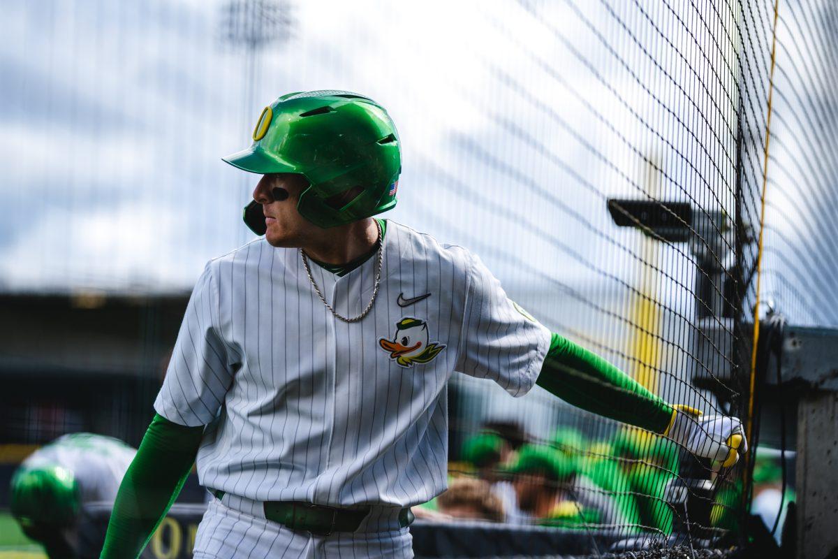 Tanner Smith (31) grabs an exercise ball before his at bat. The University of Oregon Ducks staged a late-game comeback to win 8-6 against the Utah Utes on March 19, 2022 at PK Park. (Will Geschke/Emerald)