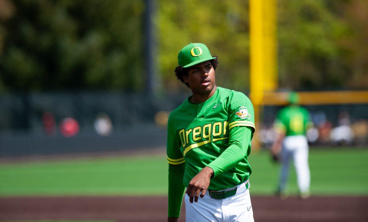 Freshman Jacob Walsh walks back to 1st base after getting an out. The Oregon Ducks Baseball team hosts Washington State at PK Park on April 24th, 2022. (Liam Sherry/Emerald)