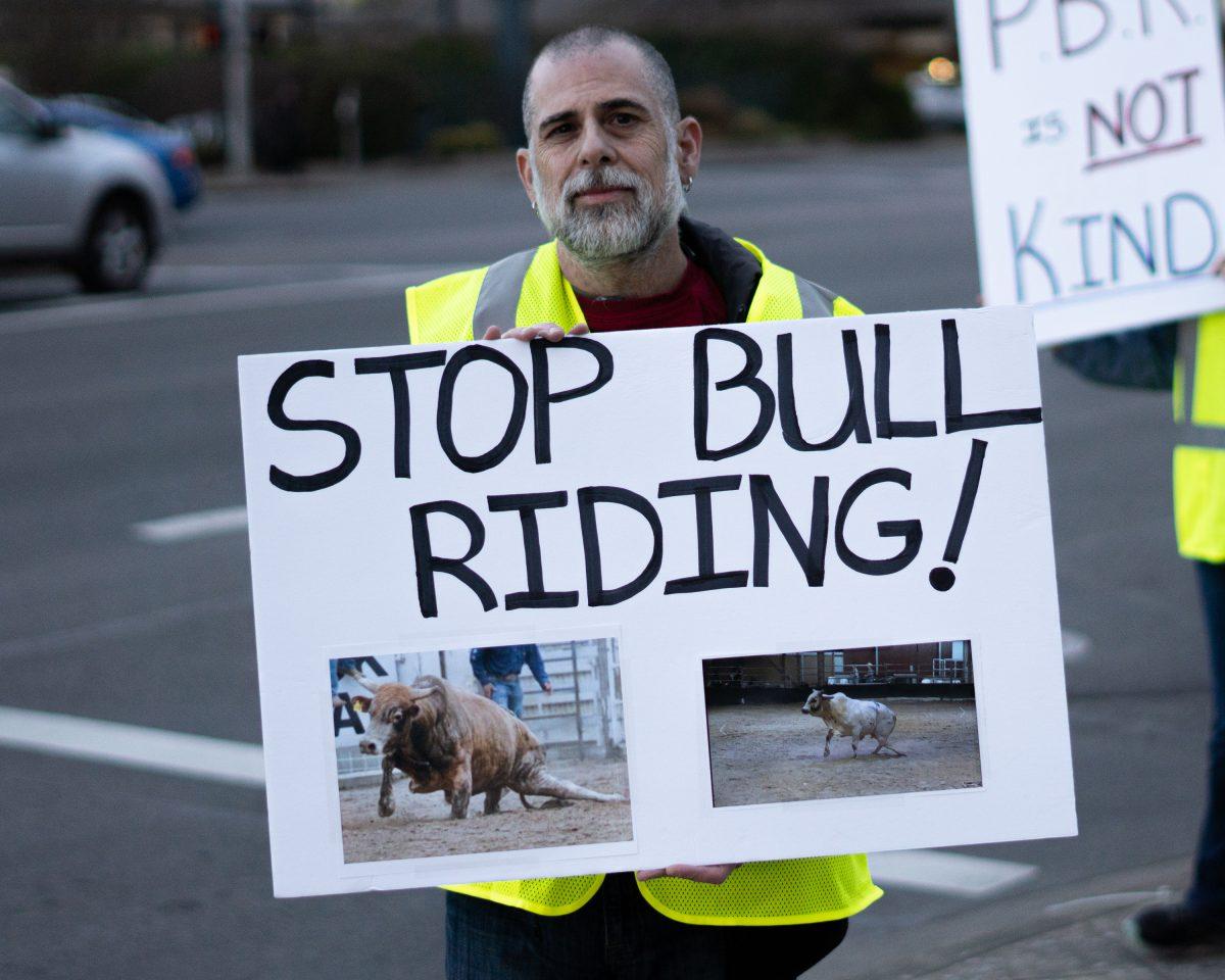 <p>Gordon Kelly, a Animal Compassion Eugene leader, protesting the PBR event. </p>