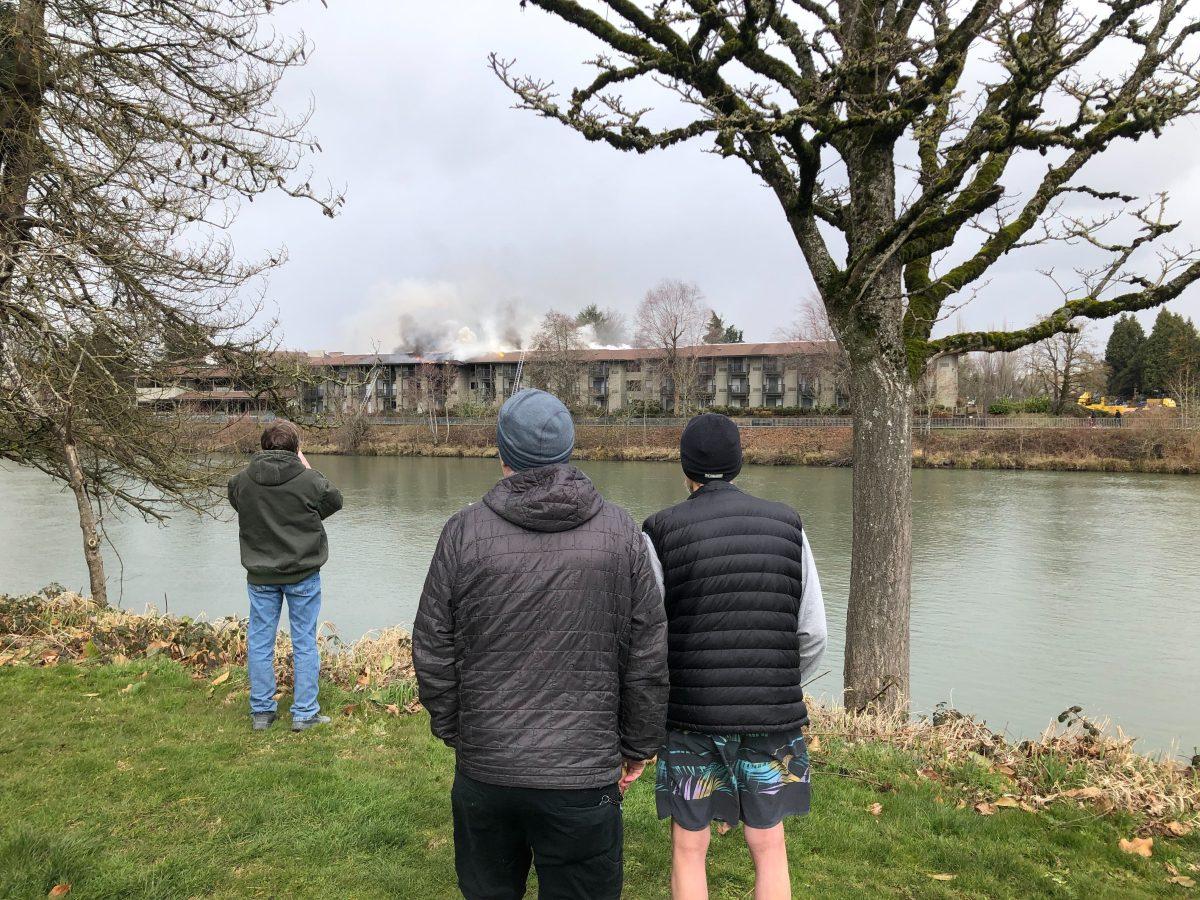 Bystanders watch the fire at Valley River Inn (image courtesy of Christian Hill).