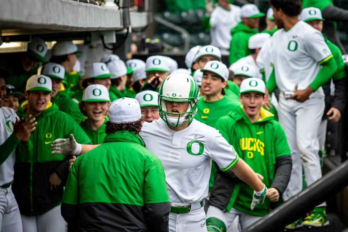 Owen Diodati (10) celebrates his first home run of the season in the dugout with his team. The Oregon Baseball team begins PAC play for the 2023 season by hosting UCLA on March 10th at PK Park. (Jonathan Suni, Emerald)