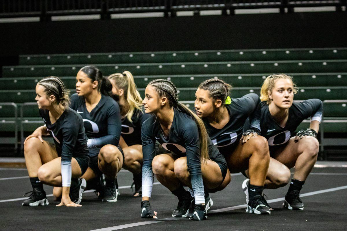 A group of Ducks prepared for the team performance. The Oregon Acrobatics and Tumbling team takes on Baylor on March 8th, 2023, at Matthew Knight Arena. (Jonathan Suni, Emerald)