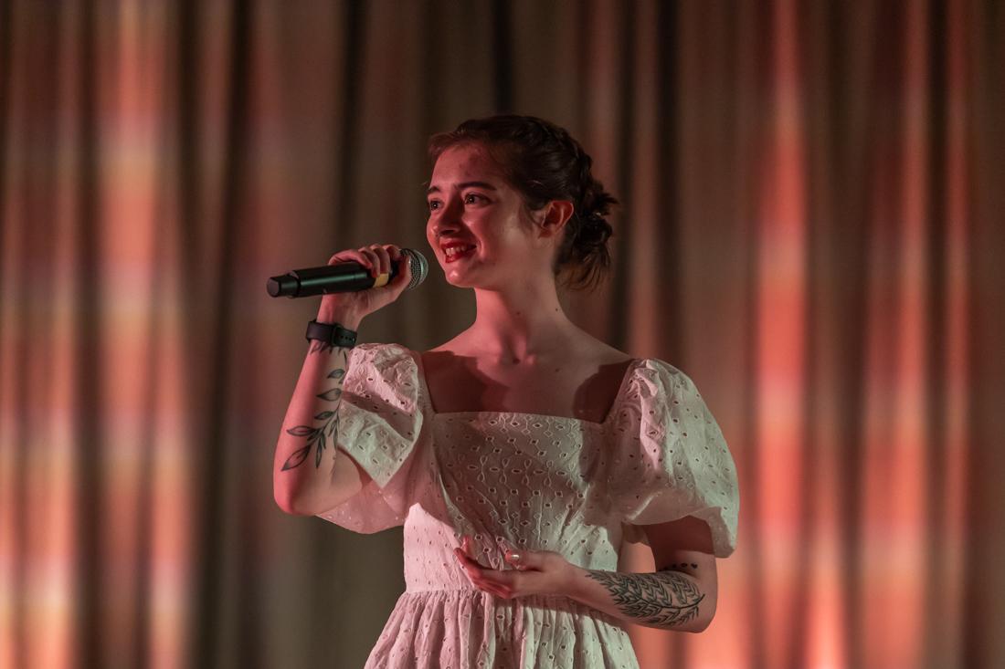 Harper Wheeler smiles while singing &#8220;Human&#8221; by dodie. Synesthesia A Showcase of the Senses took place in Global Scholars Hall on Mar. 13th, 2023. The showcase was comprised of students who are in the Performing Artists Collective residential community on campus. (Molly McPherson/Emerald)