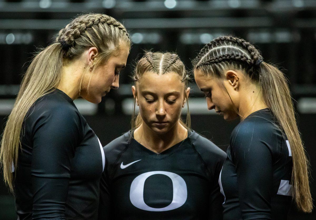 Karly Nowak (20) prepares with her teammates to perform a stunt. The Oregon Acrobatics and Tumbling team takes on Baylor on March 8th, 2023, at Matthew Knight Arena. (Jonathan Suni, Emerald)&#160;