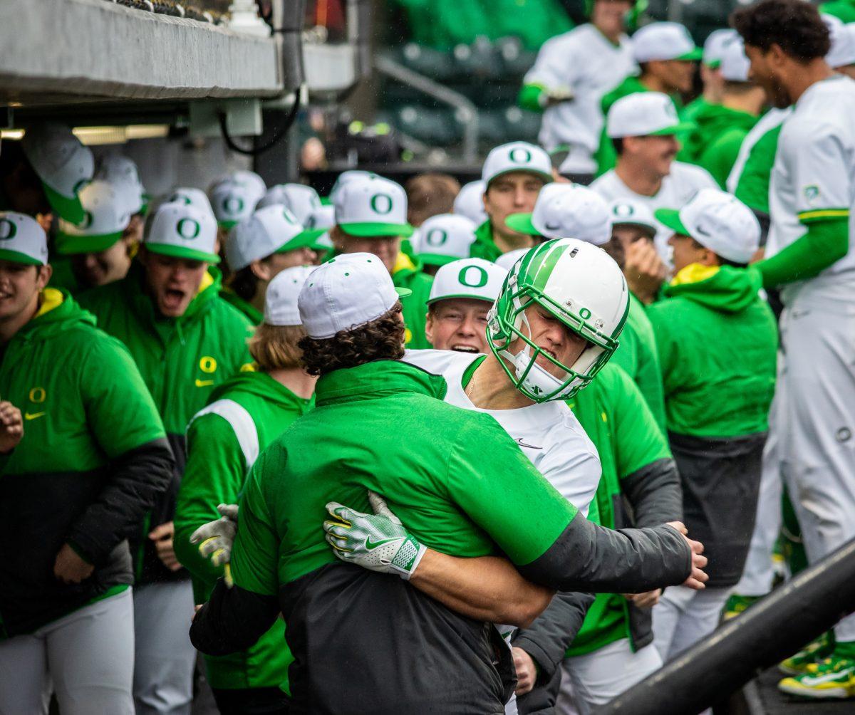 Owen Diodati (10) hugs his teammate as the team celebrates his home run.&#160;The Oregon Baseball team begins PAC play for the 2023 season by hosting UCLA on March 10th at PK Park. (Jonathan Suni, Emerald)