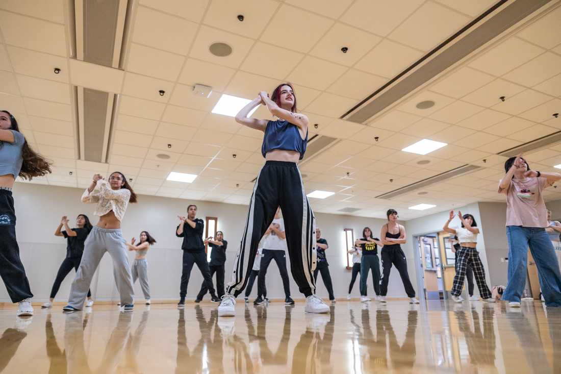 Claire Porter stands center of the group. Claire led the workshop and taught the attendees the choreography for the dance. K.Aire K-Pop Dance Crew held a dance workshop in the Student Recreation Center on Feb. 17th, 2023. The group learned a choreographed dance to ENHYPHEN's song ParadoXXX Invasion. (Molly McPherson/Emerald)