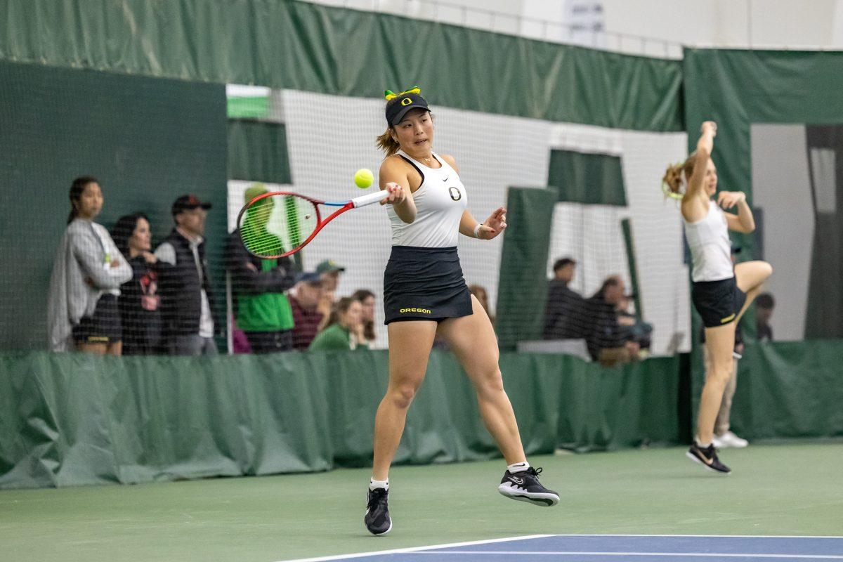 Oregon women's tennis player Jo-Yee Chan uses her forehand as she attempts to return a shot. (Photo Credit: Molly McPherson)