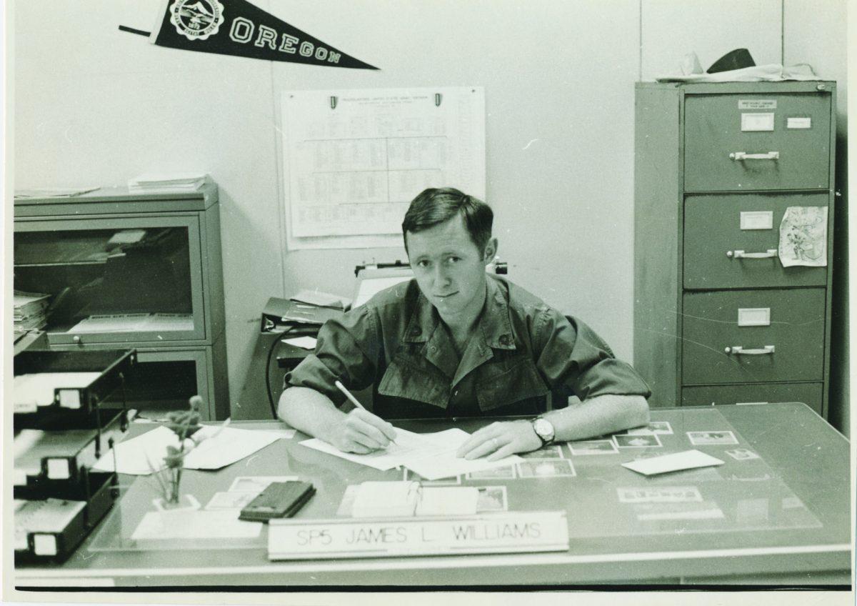 A young Jim Williams sits at his desk (photo courtesy of&#160;Eric Breitenstein).