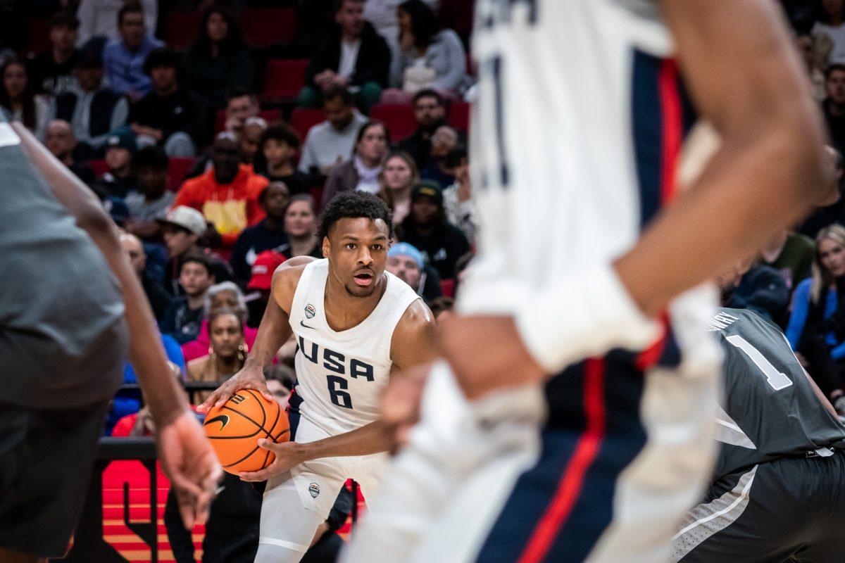 Bronny James holds the ball in the offensive zone waiting to make a play. The top high school athletes in the world represent their respective countries at the Nike Hoop Summit held at the Moda Center in Portland, Ore., on April 8th, 2023. (Jonathan Suni, Emerald).