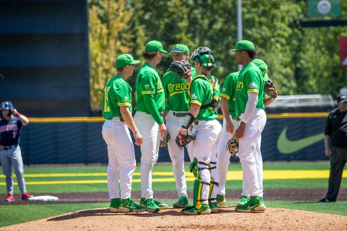 <p>The Ducks huddle on the mound after the team switches pitchers. Oregon Baseball hosts the Arizona Wildcats at PK Park on May 20, 2022. (Jonathan Suni, Emerald)</p>