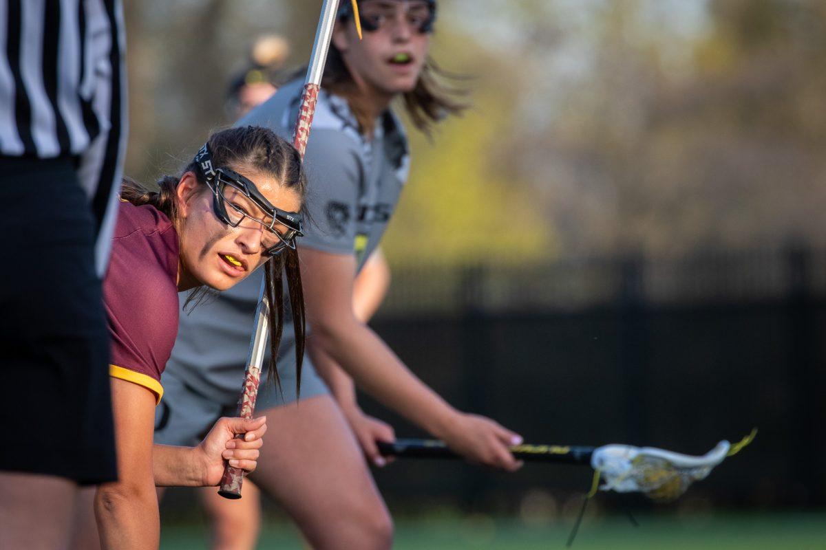 An ASU player looks to the ref to call the start of possession for the Ducks.&#160;The Oregon Ducks Lacrosse team take on the Arizona State&#160;Sound Devils at Pap&#233; Field in Eugene, Ore., on April 14th, 2023. (Jonathan Suni, Emerald)