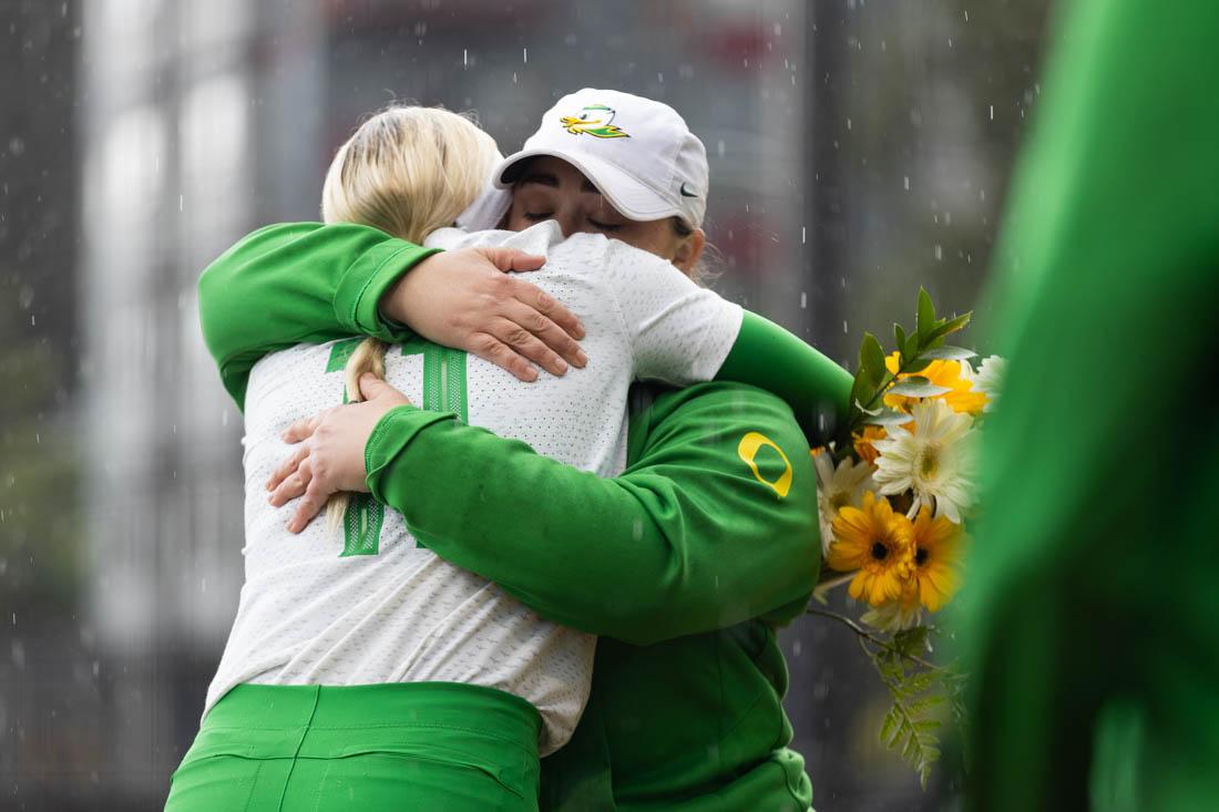 Assistant Head Coach, Sam Marder, hugs senior Terra McGowan (11) on an emotional Senior Day. Oregon Ducks softball lost 0-2 in a league series against the Utah Utes on May 7th, 2023, at Jane Sanders Stadium. (Kemper Flood/ Emerald).