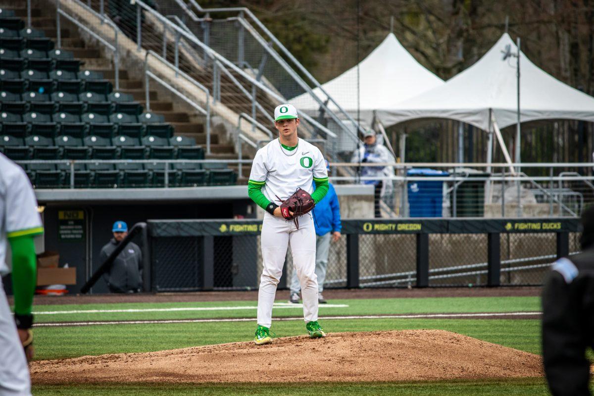 Grayson Grinsell (2) looks over to first base before pitching the ball.&#160;The Oregon Baseball team begins PAC play for the 2023 season by hosting UCLA on March 10th at PK Park. (Jonathan Suni, Emerald)