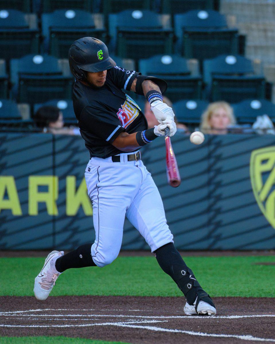 Victor Bericoto hits the ball. The Eugene Emeralds beat the Vancouver Canadians by a final score of 2-1 at P.K. Park in Eugene, Oregon, on June 23, 2023. (Eric Becker/Emerald)