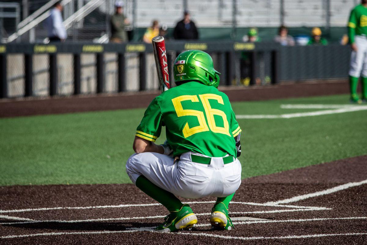 Rikuu Nishida squats down as he prepares to bat.&#160;The Oregon Baseball team takes on Xavier for their season opening series on Feb. 19th, 2023, at PK Park. (Jonathan Suni, Emerald)