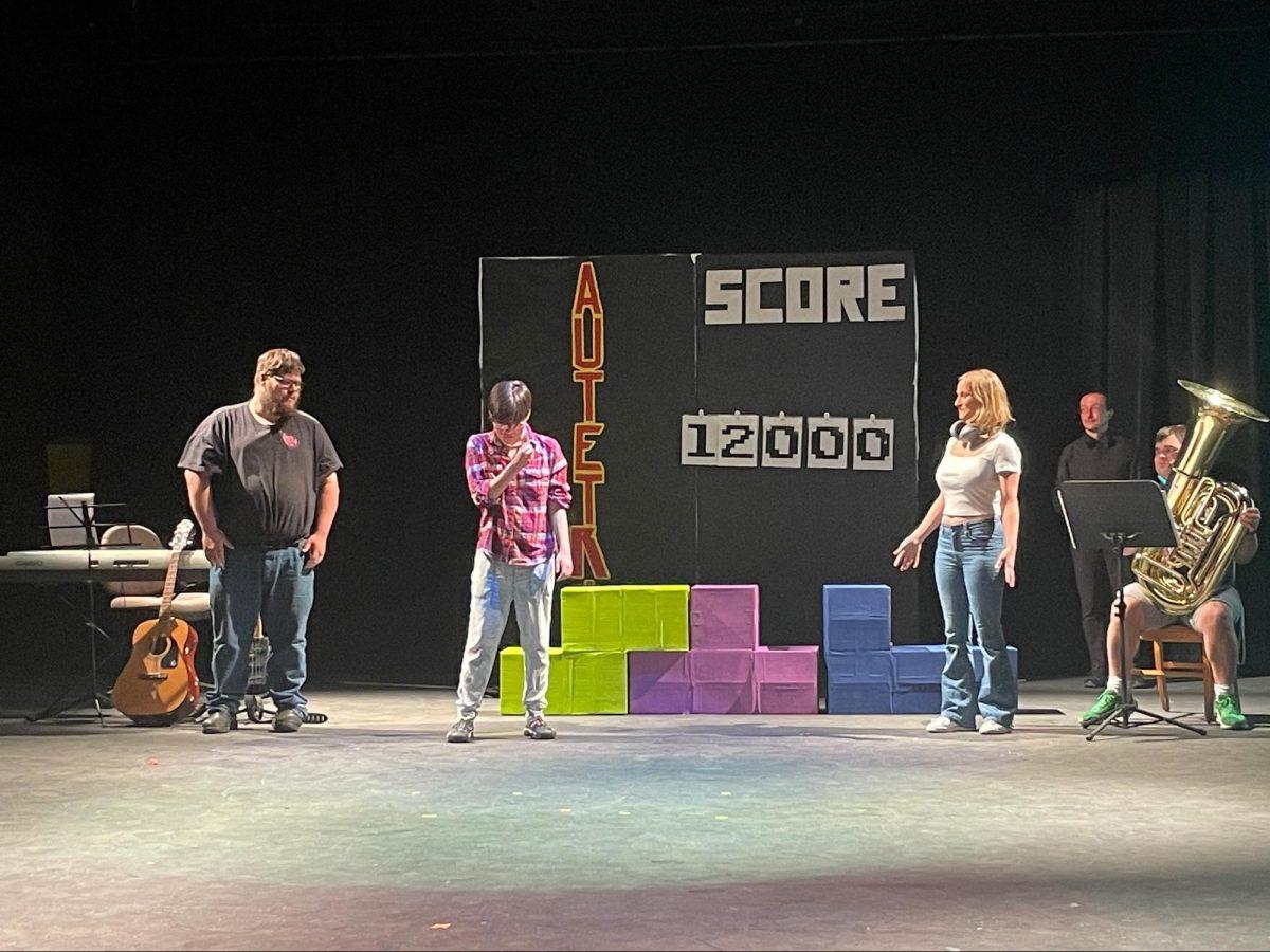 Actors pretend to take vaccines as their &#8220;AuTetris&#8221; score increases, reflecting on the inaccurate belief that vaccines cause autism. (Romie Avivi Stuhl/Emerald)