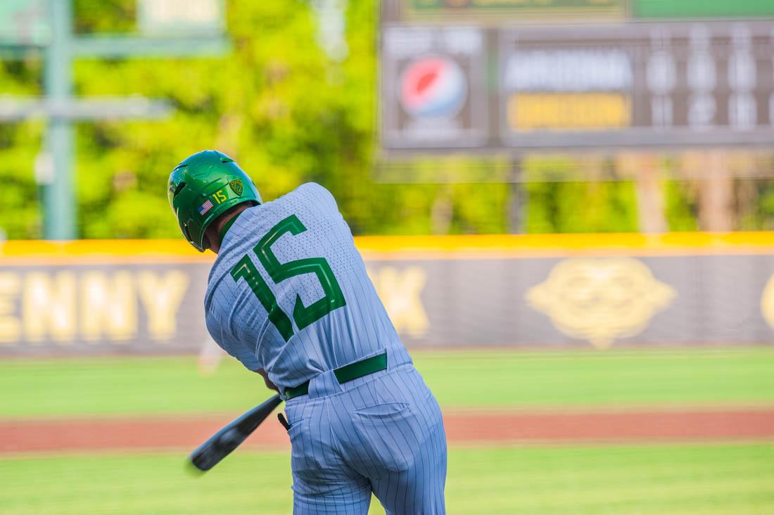 Drew Cowley (15) swings while at bat. Oregon Baseball takes on University of Arizona at PK Field in Eugene, Ore. on May 20, 2022. (Mary Grosswendt/Emerald)