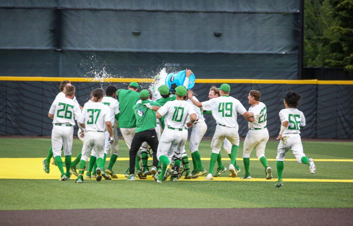 The Oregon Ducks celebrate a walkoff win to cap off the first ever 8-run-comeback in Super Regional history. The Oregon Baseball team defeats Oral Roberts in game 1 of Super Regionals on June 9th at PK Park. (Kai Kanzer/Emerald)