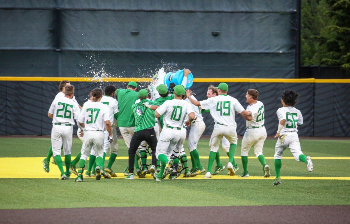 The Oregon Ducks celebrate a walkoff win to cap off an 8-run-comeback. The Oregon Baseball team defeats Oral Roberts in game 1 of Super Regionals on June 9th at PK Park. (Kai Kanzer/Emerald)