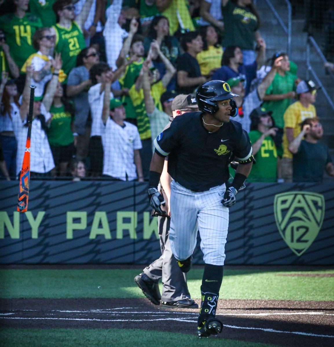 Sabin Ceballos (21) bat flips after hitting a home run in back to back days. Oral Roberts punches their ticket to the College World Series by defeating the Oregon Baseball team in Game 3 of Super Regionals on June 11th at PK Park. (Kai Kanzer/Emerald)