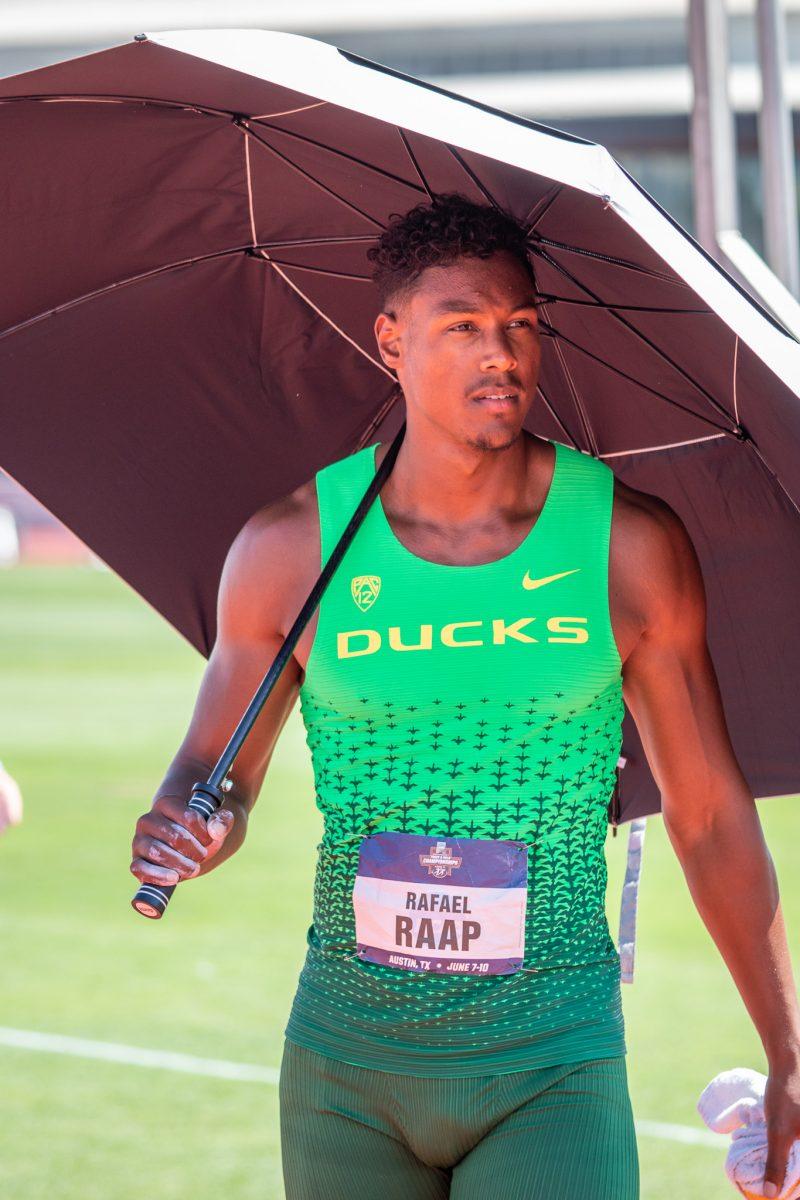 Oregon athlete, Rafael Raap, protects himself from the scorching sun as he prepares for a long day of competing in the decathlon.&#160;The top athletes in college meet at the University of Austin for the NCAA National Championship in Austin, TX, from June 7th to June 10th, 2023. (Jonathan Suni, Emerald)