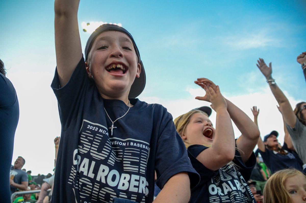 Young Oral Roberts fans celebrate a double. Oral Roberts defeats the Oregon Baseball team in game 2 of Super Regionals on June 10th at PK Park. (Kai Kanzer/Emerald)