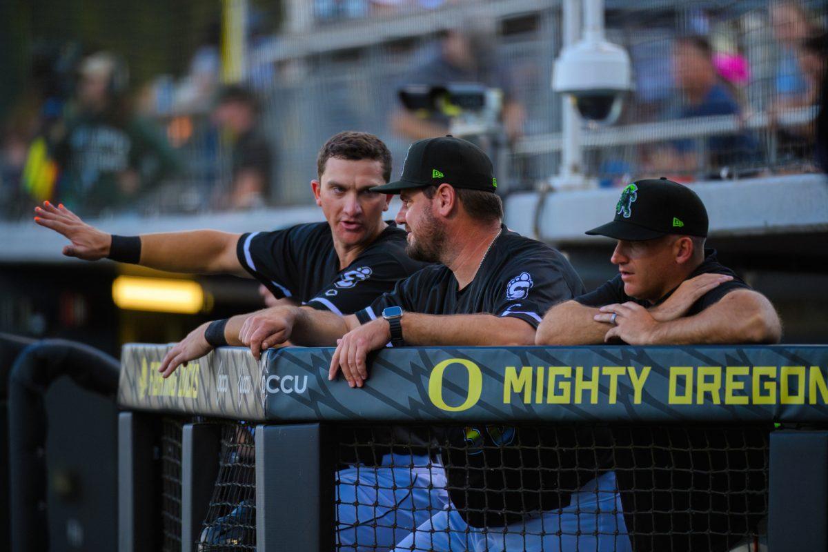 Coaches talk amongst themselves in the dugout. The Eugene Emeralds beat the Vancouver Canadians by a final score of 2-1 at P.K. Park in Eugene, Oregon, on June 23, 2023. (Eric Becker/Emerald)