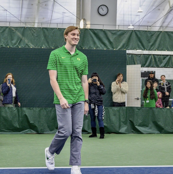 Oregon women&#8217;s tennis fans, family and friends celebrate their student manager, Fletcher Ahl, on Senior Day 2023 in the Student Tennis Center