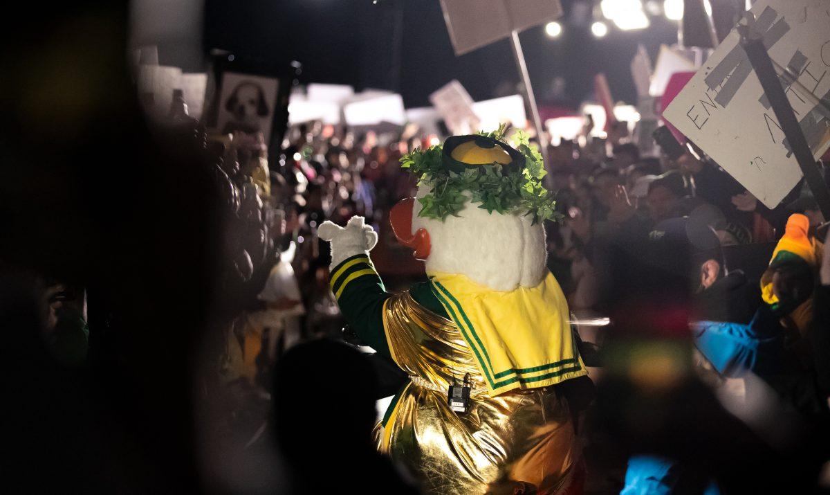 Oregon's famed mascot rides through a crowd of students to kick off the show. Oregon hosts College Gameday bright and early on the Lillis lawn October 22, 2022 before their game against no.9 UCLA.&#160;(Liam Sherry/Daily Emerald)