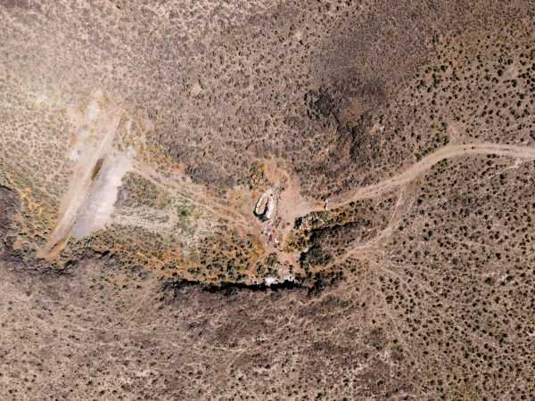 An aerial view of the excavation site. The University of Oregon Archaeological Field School excavates at the Rimrock Draw Rockshelter near Burns, Oregon, on August 1, 2023. (Eric Becker/Emerald)