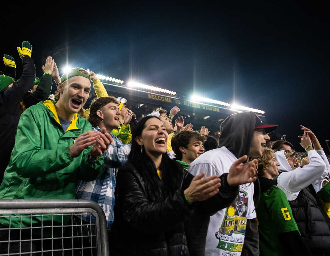 Ducks fans sing and clap along to Oregon&#8217;s end of third quarter tradition, the playing of &#8220;Shout.&#8221; The University of Oregon Ducks hosted the University of Washington Huskies at Autzen Stadium in Eugene, Ore., on November 12th, 2022 for game 10 of the 2022 season. (Ian Enger/Emerald)