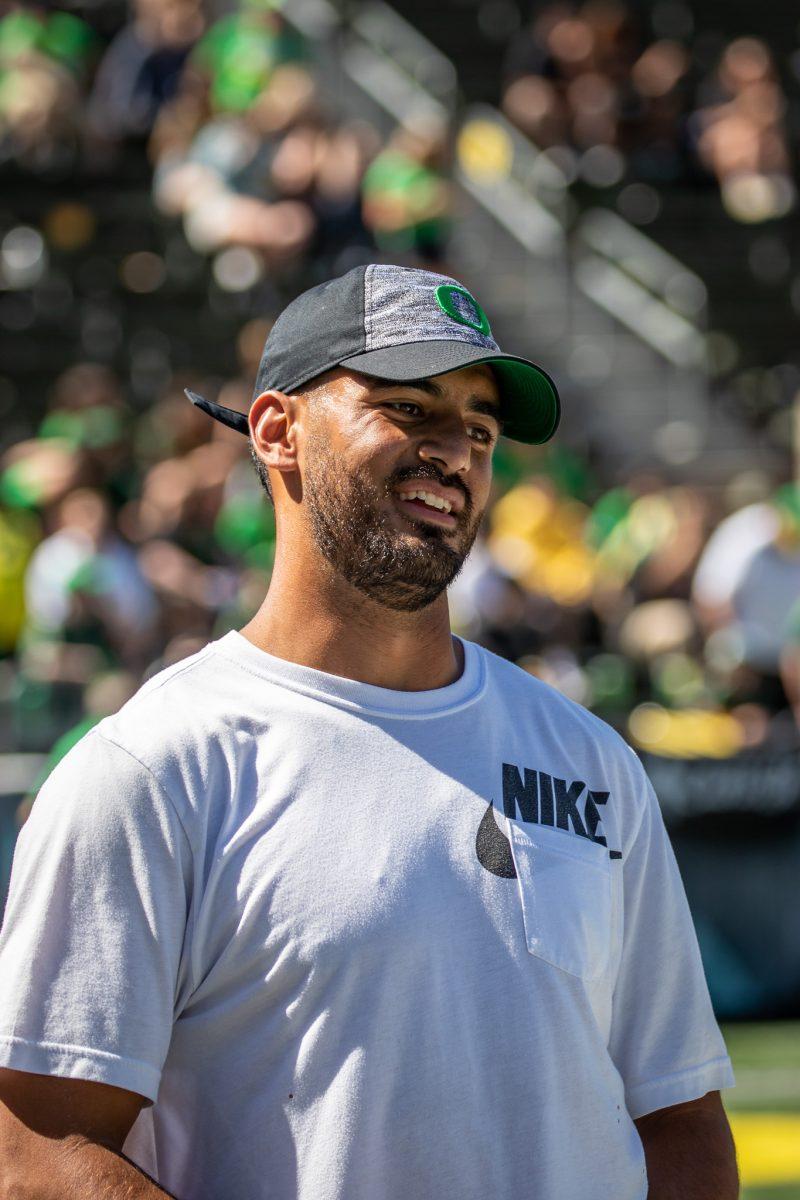 Legendary Oregon Duck, Marcus Mariota, laughs as he catches up with fellow alumni.&#160;The University of Oregon holds their annual spring game&#160;at Autzen Stadium in Eugene, Ore., on April 29, 2023. (Jonathan Suni, Emerald)