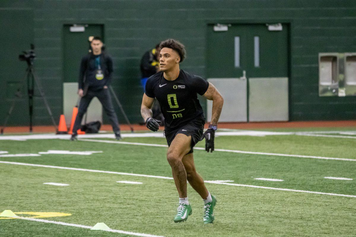 <p>First round prospect, Christian Gonzalez, performs a catching drill to show off his abilities. (Jonathan Suni, Emerald)</p>