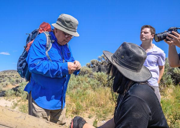 Pat O'Grady examines an artifact. The University of Oregon Archaeological Field School excavates at the Rimrock Draw Rockshelter near Burns, Oregon, on July 31, 2023. (Eric Becker/Emerald)