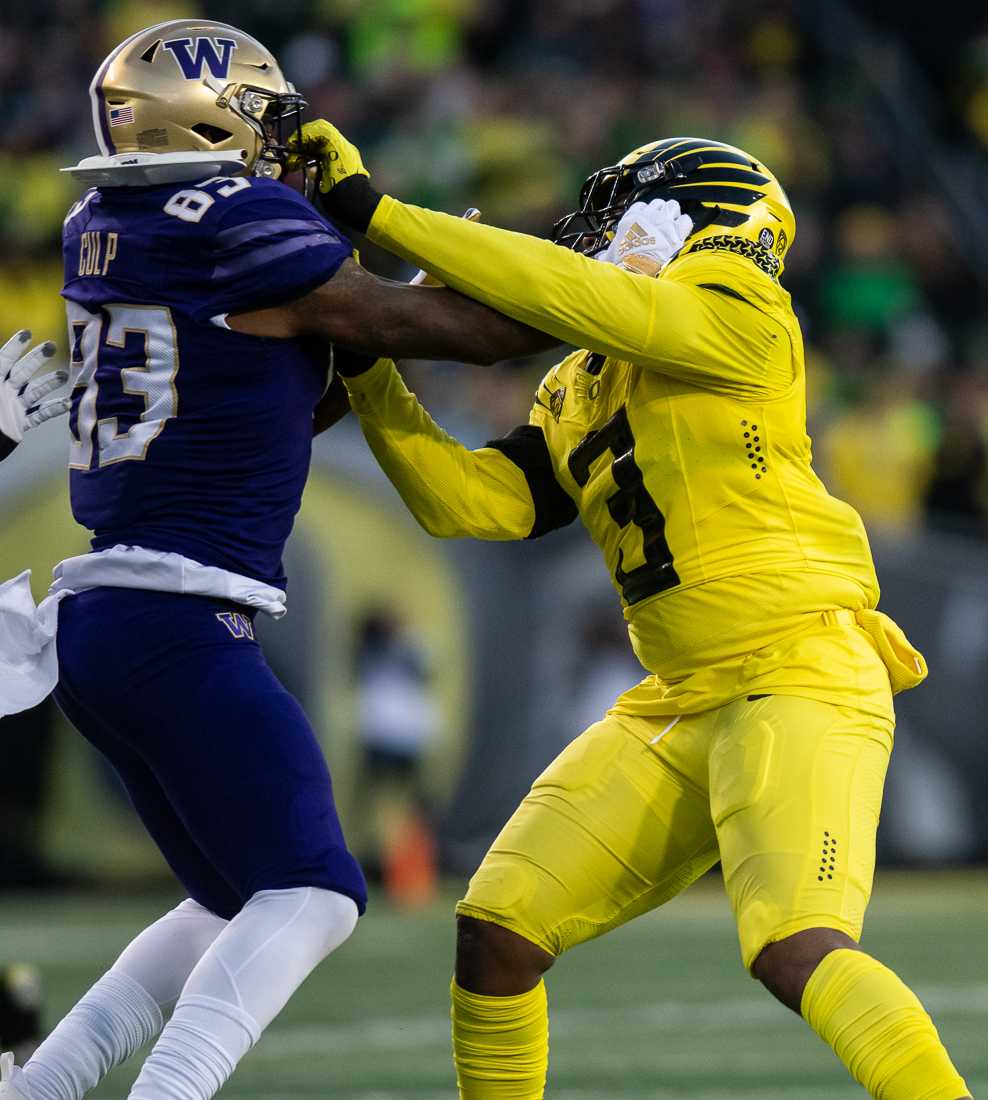 Ducks defensive end Brandon Dorlus (3) clashes with Huskies tight end Devin Clup (83). The University of Oregon Ducks hosted the University of Washington Huskies at Autzen Stadium in Eugene, Ore., on November 12th, 2022 for game 10 of the 2022 season. (Ian Enger/Emerald)