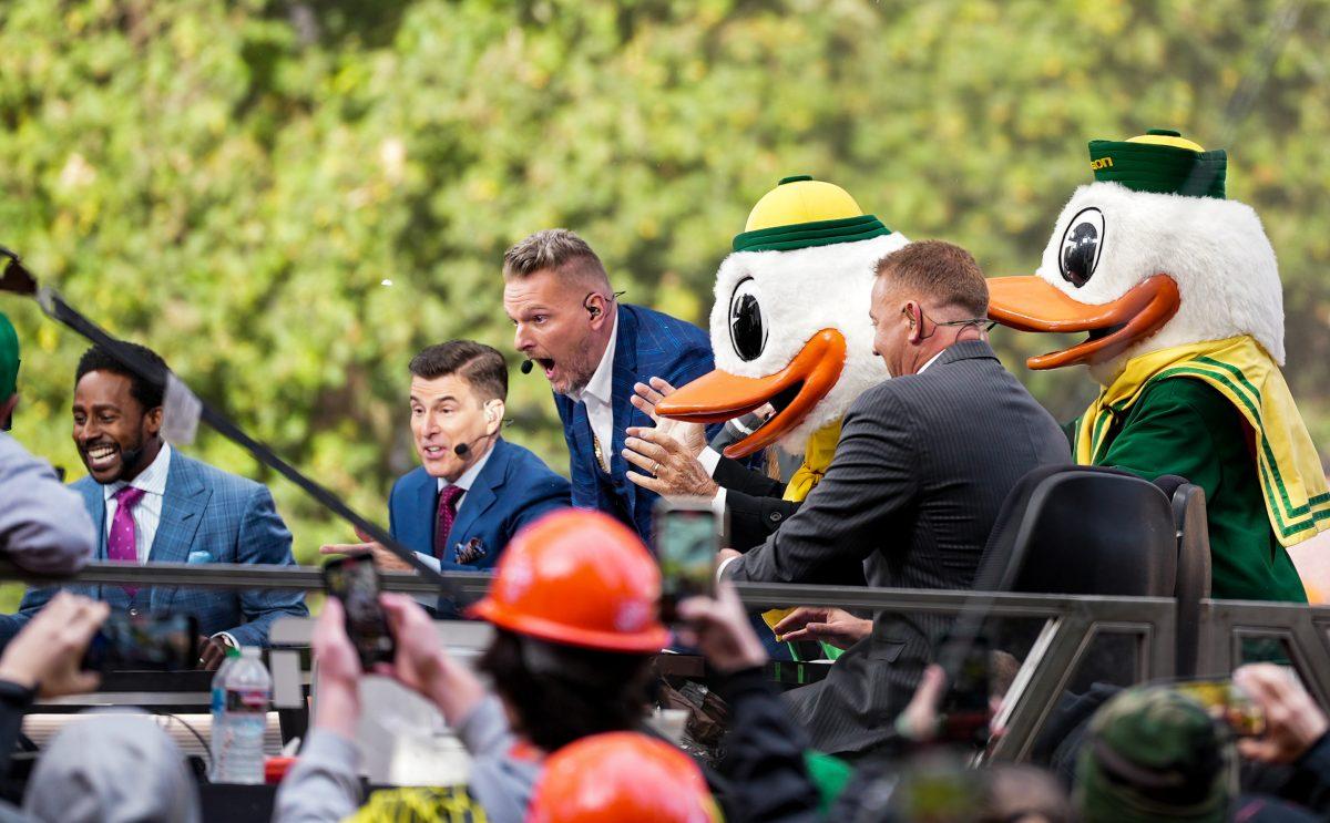 <p>The College Gameday crew reacts after Lee Corso dawns the duck head and announces Oregon as his choice to win the game. Oregon hosts College Gameday bright and early on the Lillis lawn October 22, 2022 before their game against no.9 UCLA. (Liam Sherry/Daily Emerald)</p>