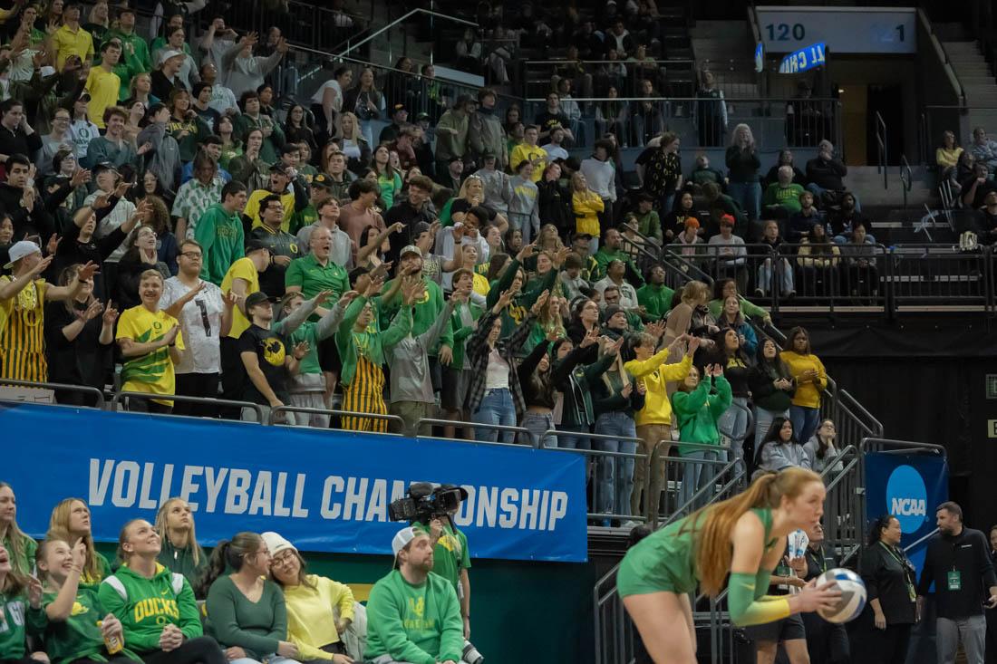 The student section cheers on Hannah Puki prior to her serve late in the second set. Oregon Women&#8217;s Volleyball host their second round NCAA Volleyball Championship Tournament opponent the Arkansas Razorbacks at Matthew Knight Arena in Eugene, Ore., on Dec. 1, 2022. (Skyler Davis/ Emerald)