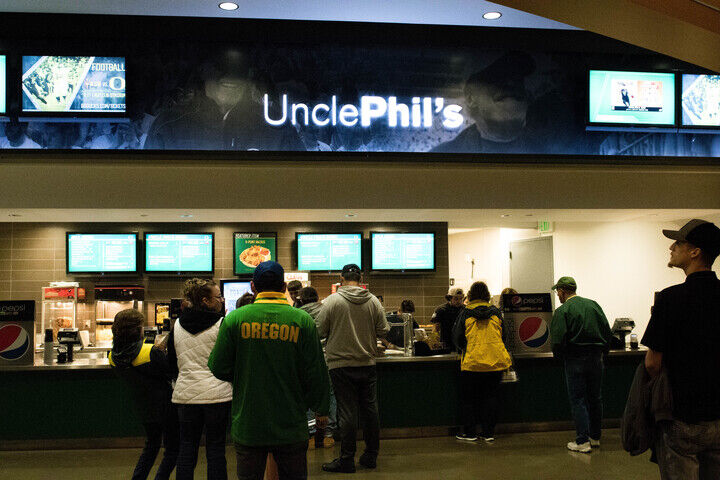 Duck fans line up at the concessions stand at Matthew Knight Arena. (Madison Mather/Emerald)