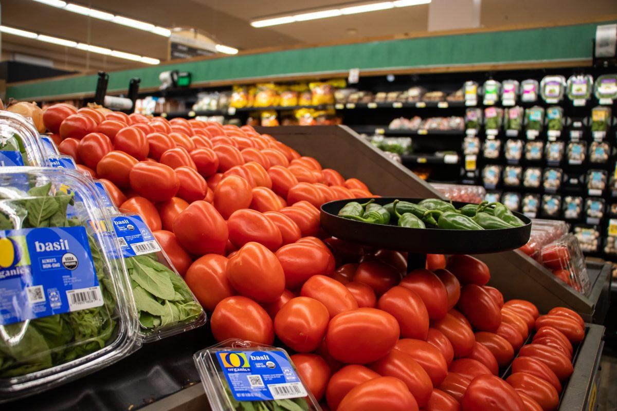 A freshly stocked pile of tomatoes welcomes customers to take some fresh produce home. (Jonathan Suni, Emerald)