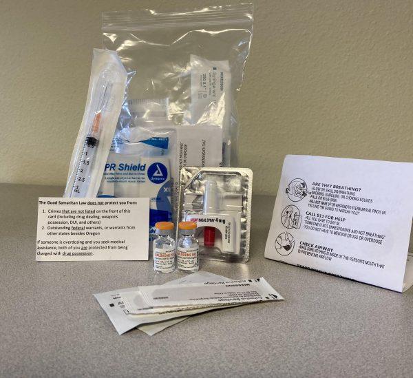 <p>An injection Naloxone kit. This kit includes a dose of nasal Narcan, instructions on giving Narcan, a CPR face shield, syringes, two doses of injection Naloxone and an information card about Oregon's Good Samaritan Law. (Courtesy of Rebecca Noad and HIV Alliance)</p>