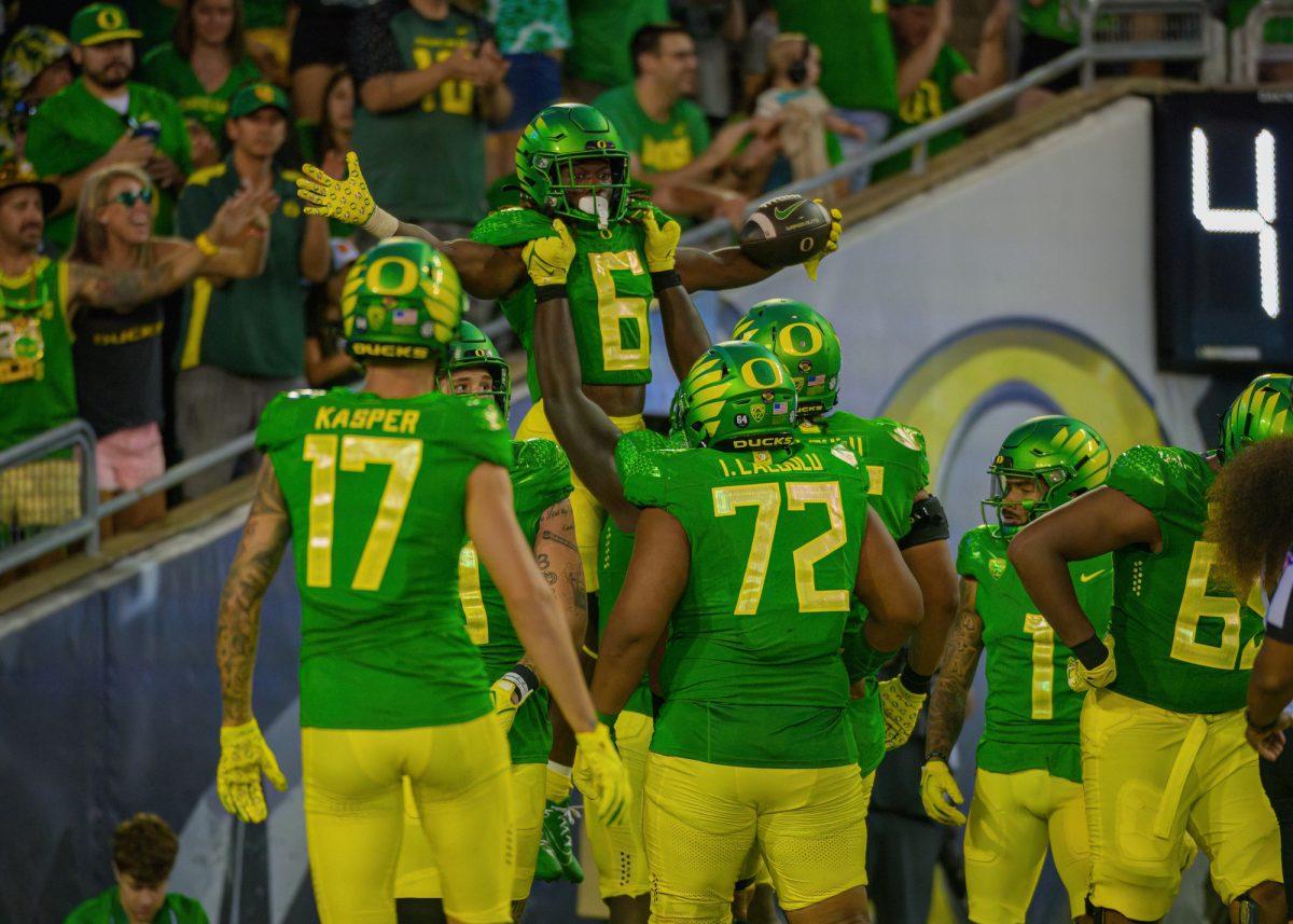 Noah Whittington (6) is lifted up after scoring. The University of Oregon Ducks Football team defeated the University of Hawaii Rainbow Warriors in a home match at Autzen Stadium in Eugene, Oregon, on September 16, 2023. (Eric Becker/Emerald)