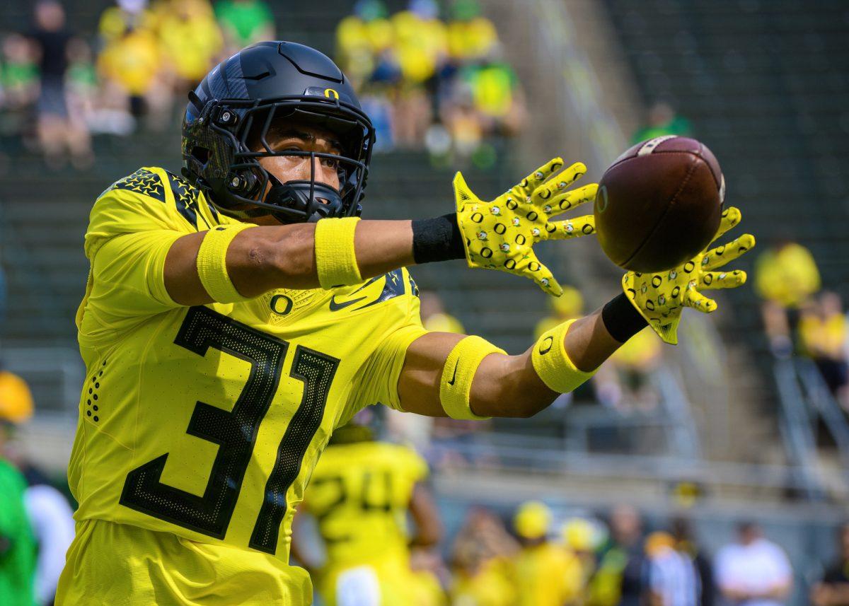 Kodi DeCambra catches the ball during warm ups. The University of Oregon Ducks Football team defeated the Portland State University Vikings in a home match at Autzen Stadium in Eugene, Oregon, on September 2, 2023. (Eric Becker/Emerald)