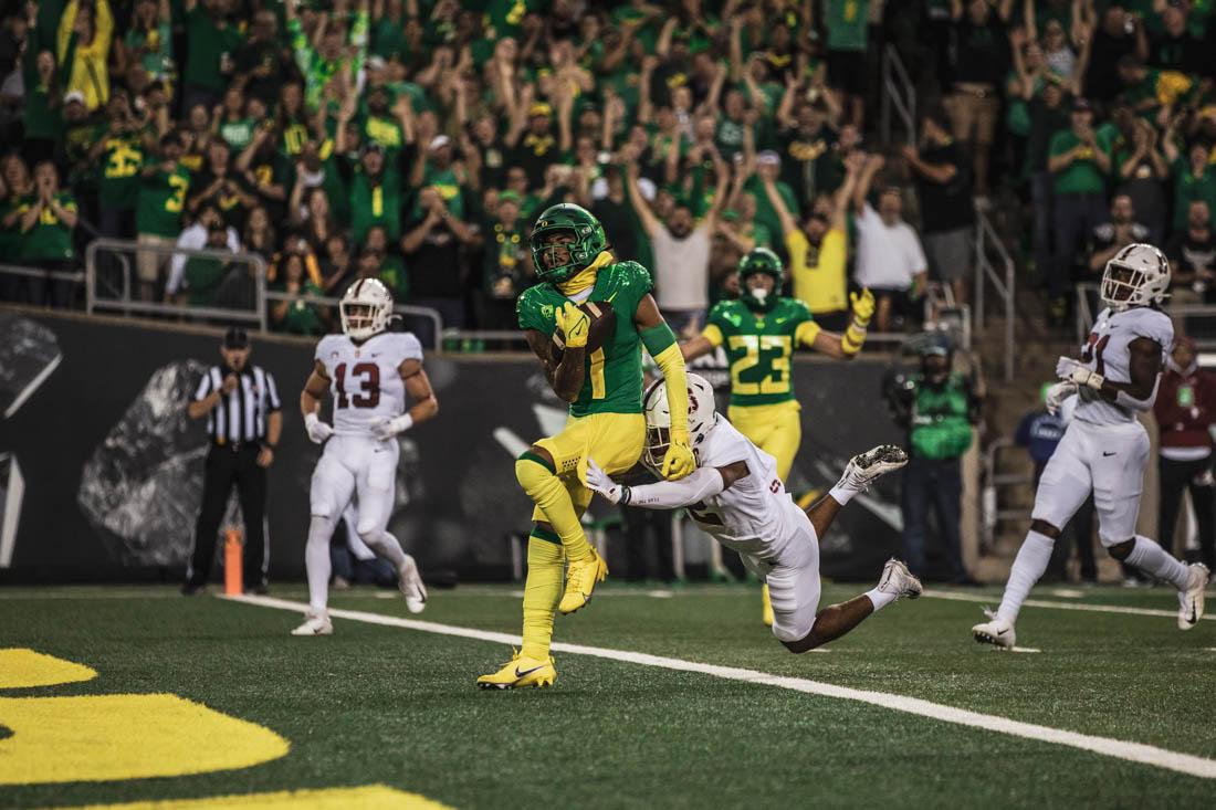 Ducks sophomore wide receiver Kris Hutson (1) scores a touchdown for the Ducks with Cardinal defense on his heels. The University of Oregon Ducks take on the Stanford Cardinal on Oct. 1, 2022 at Autzen Stadium in Eugene, Ore.(Maddie Stellingwerf/Emerald)