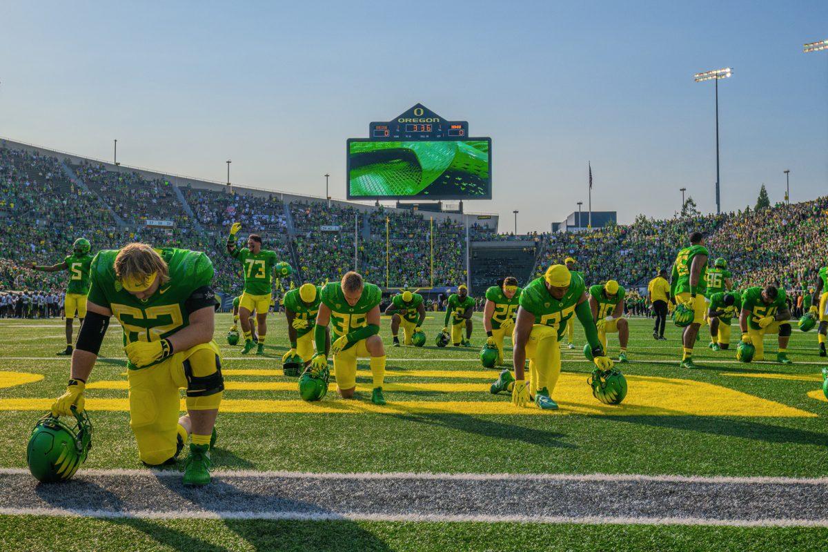 <p>Players gather in the endzone to pray before the game. The University of Oregon Ducks Football team defeated the University of Hawaii Rainbow Warriors in a home match at Autzen Stadium in Eugene, Oregon, on September 16, 2023. (Eric Becker/Emerald)</p>