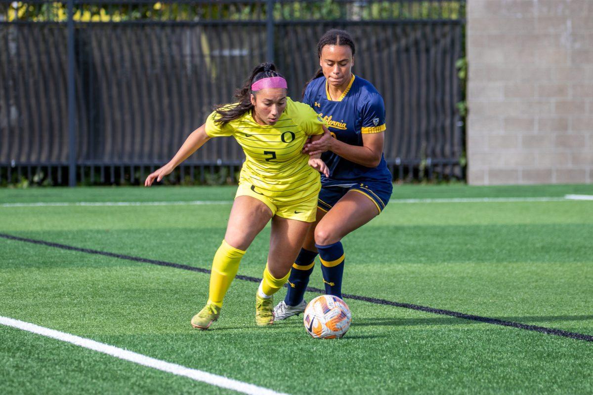 Anna Emperador (2) and Cal defender wrestle for possession of the ball.&#160;The Ducks host the Golden Bears at Papa Field on October 23rd, 2022. (Jonathan Suni, Emerald)