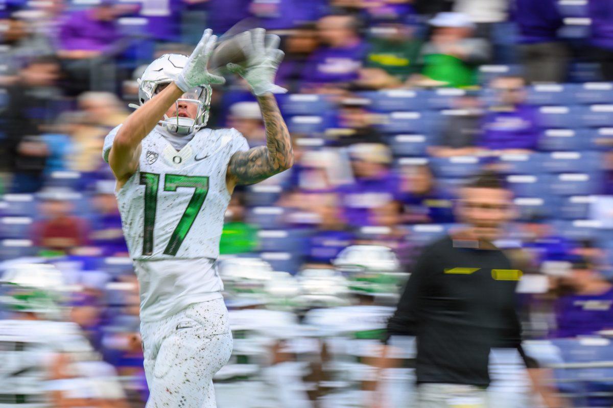 Kyler Kasper (17) catches the ball during warm ups. The University of Oregon Ducks Football team were defeated by the University of Washington Huskies in an away match at Husky Stadium in Seattle, Washington, on October 14, 2023. (Eric Becker/Emerald)