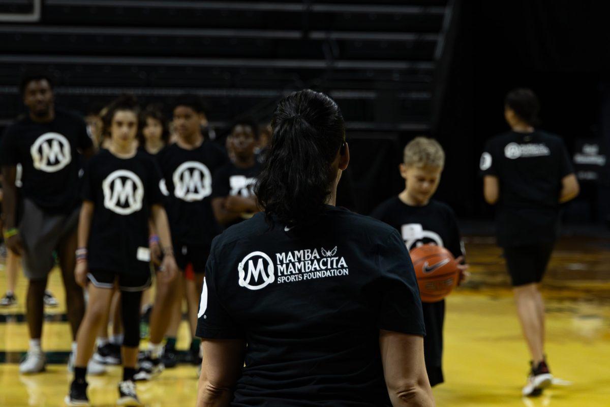 The Mambacita logo on our leader's back represents the legacy of determination and passion we pass on to the next generation of athletes. University of Oregon&#8217;s men's and women's basketball teams host a basketball clinic in partnership with the Mamba and Mambacita Sports Foundation at Matthew Knight Arena in Eugene, Ore., on Sunday, October 8th. (Sebastian Flores/Emerald)