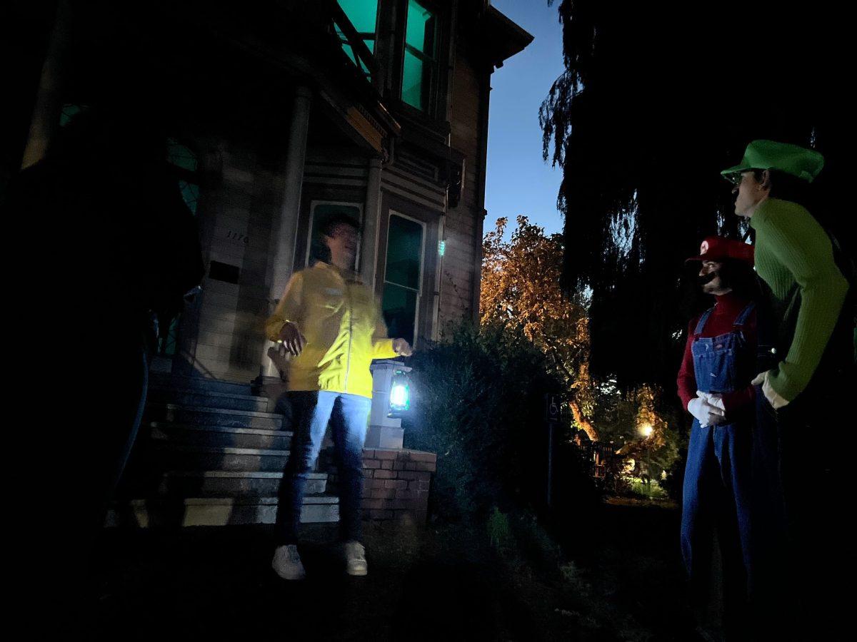 University of Oregon students and community members visit University Hall and the Collier house during the "haunted campus" tour led by University of Oregon ambassadors. (Proctor/Emerald)