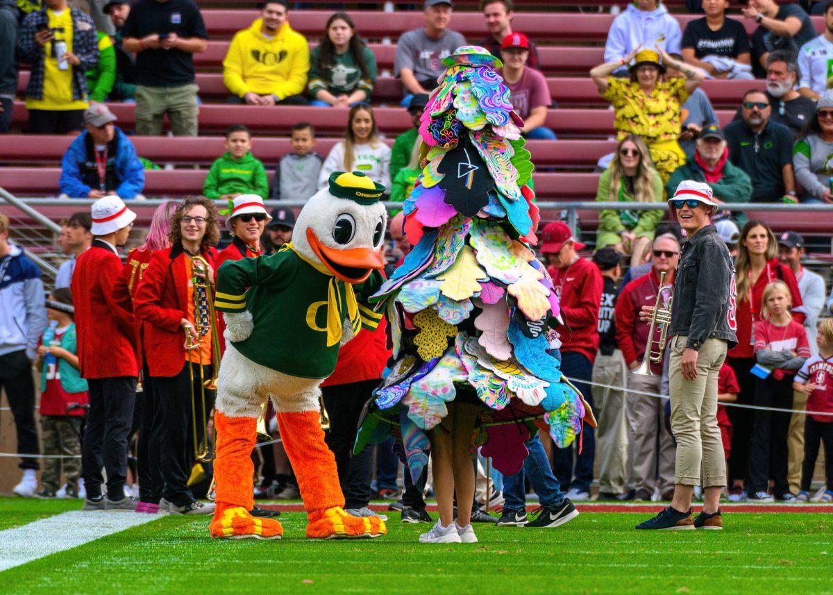 <p>The Duck greets the Stanford Tree before the game. The University of Oregon Ducks football team defeated the Stanford University Cardinals in an away match at Stanford Stadium in Stanford, Calif., on Sept. 30, 2023. (Eric Becker/Emerald)</p>