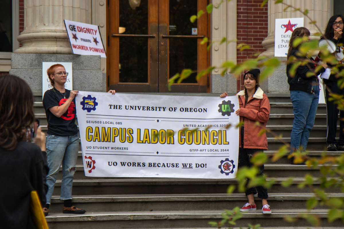 GTFF and UOSW members gather on the steps of UO&#8217;s Johnson Hall in protest for contract revisions and fairer pay. (Eliott Coda/Emerald)